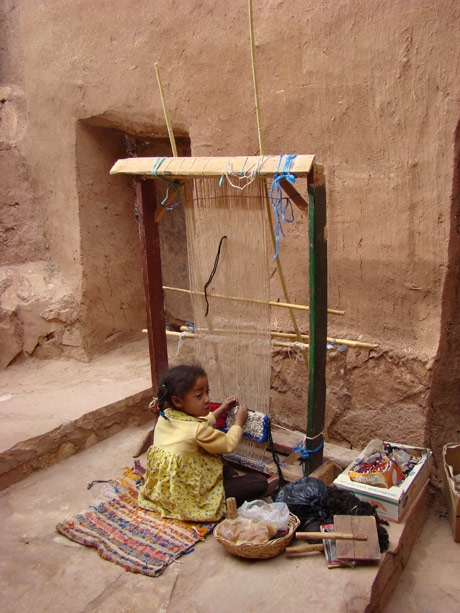 “Young girl working fairtrade Young girl working on a loom in Aé¯t Benhaddou, Morocco in May 2008” - image is courtesy of NationMaster.com 